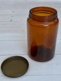 Dark glass storage jar with lid