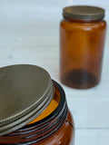 Dark glass storage jar with lid
